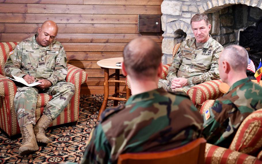 Gen. James McConville, Army chief of staff, and U.S. Army Europe commander Gen. Darryl Williams, left, listen to allied leaders at a conference of European armies in Garmisch-Partenkirchen, Germany, on July 7, 2022.