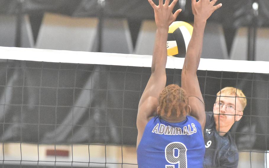 Black Forest Academy’s Barney Sivonen hits the ball into the block of Rota’s Brian Lieba on Saturday, Oct. 28, 2023, in the championship match of the DODEA-Europe boys volleyball tournament.