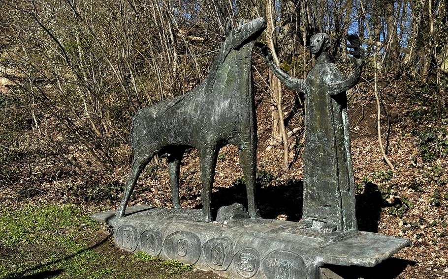 The sculpture “Mann mit Pferd,” or "Man with Horse," can be seen with gloves on for the winter months in Erlangen, Germany. Sculptures in the garden wear different clothing and decorations for the seasons. 