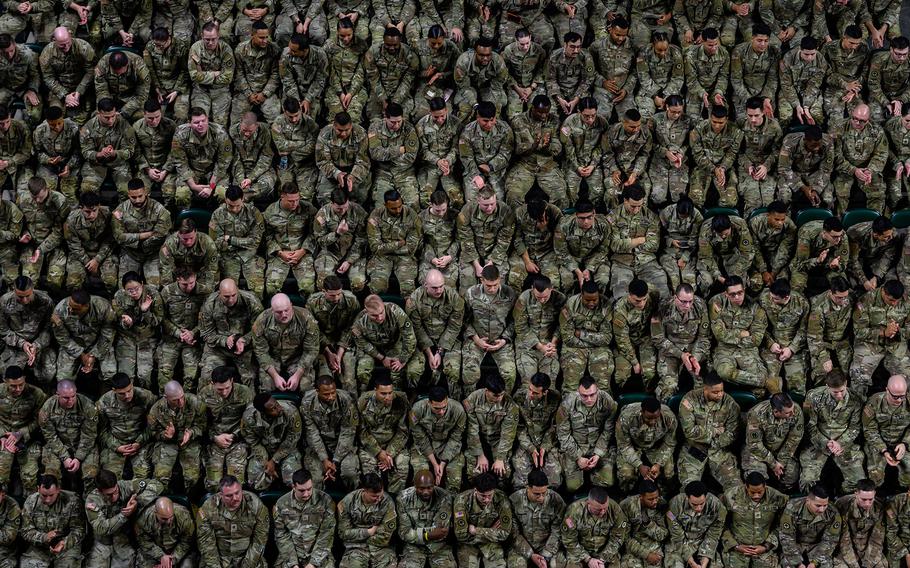 New Jersey National Guard soldiers sit during a farewell ceremony in Trenton, N.J., Jan. 14, 2024. More than 1,500 of the soldiers are deploying to support U.S. Central Command operations in Iraq and Syria. Bases used by U.S. forces in the Middle East have been targets of attacks by Iranian-backed militias.