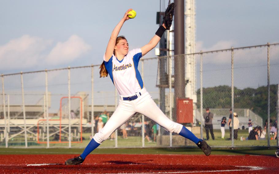 Zaylee Gubler sets to hurl a pitch homeward.