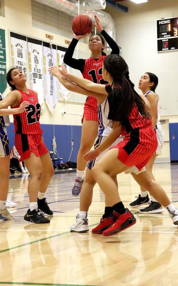 Nile C. Kinnick’s Kamiyah Dabner puts up a shot in the third quarter of a game against Yokota on Friday.