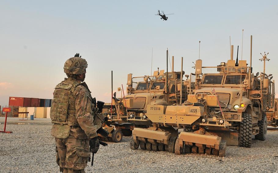 Staff Sgt. Jose A. Antepara guides a vehicle at Bagram Airfield, Afghanistan, as part of preparation for an upcoming mission in December 2013.