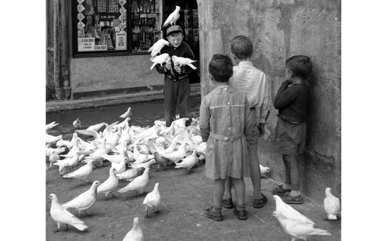 Valencia, Spain, June 3, 1956:  A boy makes some feathered friends on a Valencia street.

Looking for Stars and Stripes’ historic coverage? Subscribe to Stars and Stripes’ historic newspaper archive! We have digitized our 1948-1999 European and Pacific editions, as well as several of our WWII editions and made them available online through https://starsandstripes.newspaperarchive.com/

META TAGS: Spain; pigeons; children; 