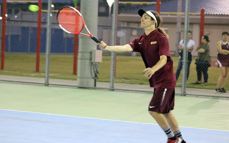 Matthew C. Perry's Layne Mayer smacks a forehand return against E.J. King during Friday's DODEA-Japan tennis matches. Mayer lost his singles match to Joseph Barrett 8-6, but teamed with Max Bailey to beat Christian Garcia and David Axsom 8-4 in doubles. 