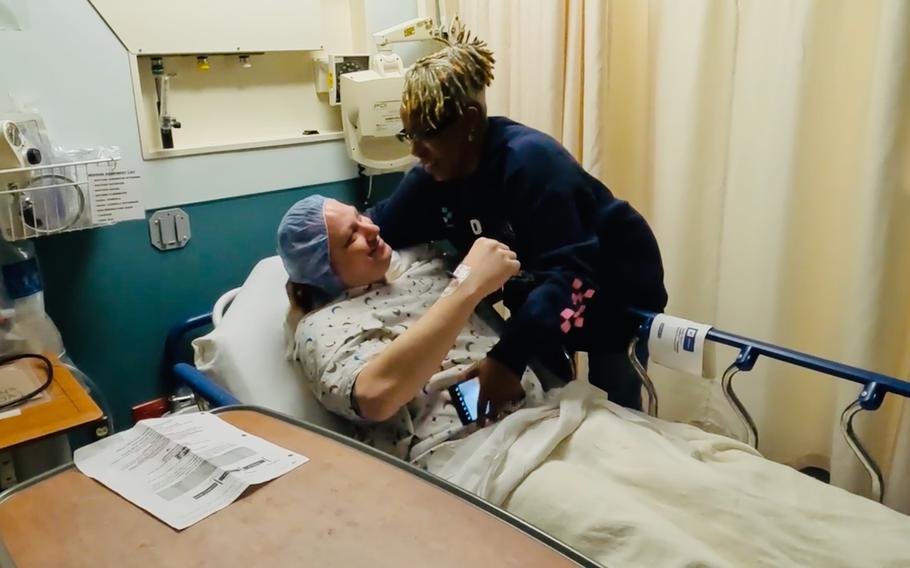 Denise Epps-Harris gives Russ Redhead a hug before the transplant surgery. 