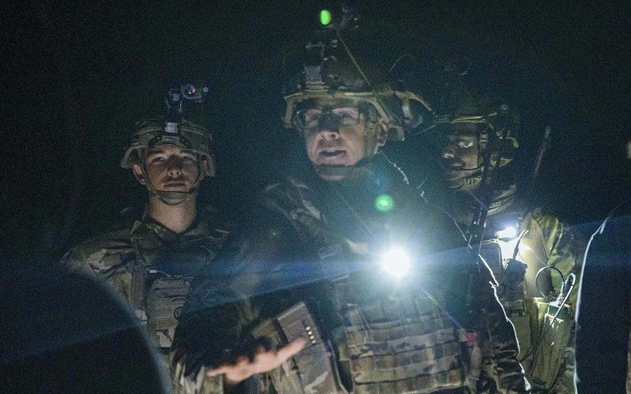 U.S. service members reassure partner forces during a night patrol at Al Asad Air Base, Iraq, on Dec. 24, 2022. Patrols in the region maintain positive relationships with partner forces to advise, assist and enable them in the ongoing defeat of ISIS. 