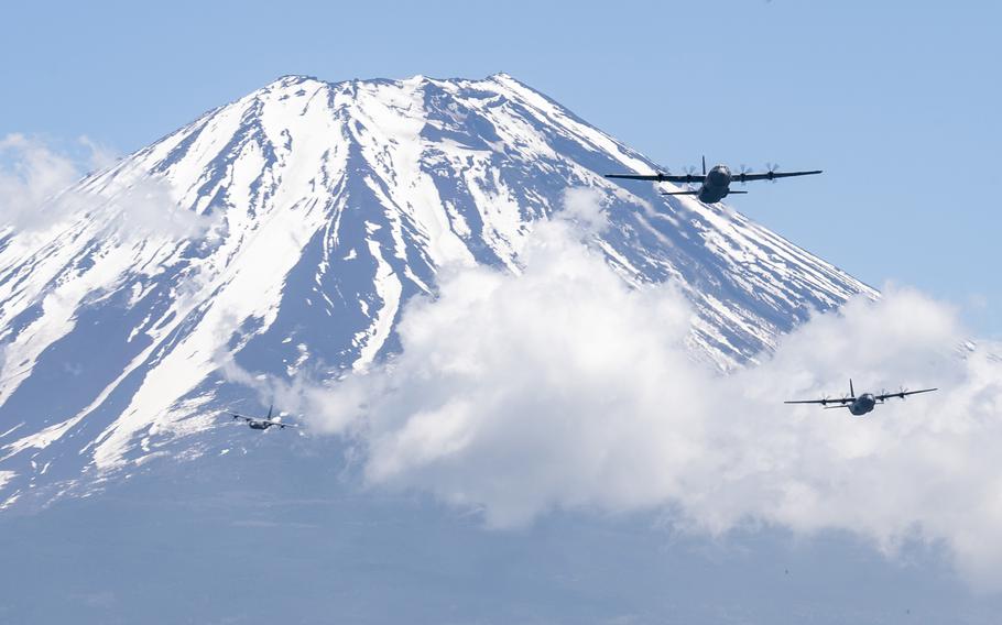 Three C-130J Super Hercules from the 36th Airlift Squadron at Yokota Air Base, Japan, fly near Mount Fuji, May 11, 2020.