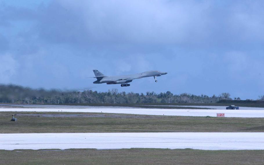 A B-1B Lancer bomber takes off from the runway at Andersen Air Force Base, Guam.  The bomber is from the 7th Air Expeditionary Wing. 