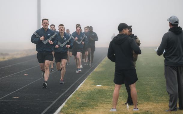 Airmen run during a physical fitness assessment at Fairchild Air Force Base, Wash., on Oct. 29, 2024. A screenshot purporting to show upcoming changes to the Air Force fitness test program was published on social media.
