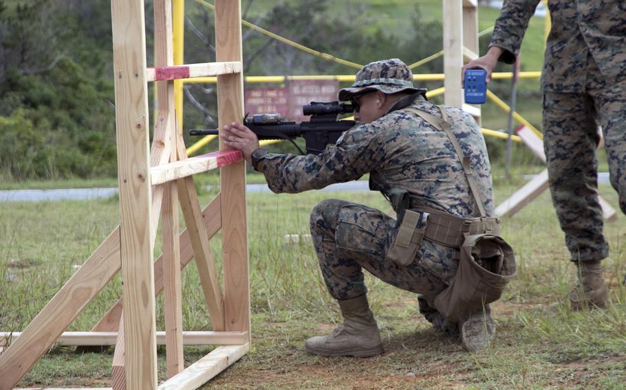 A Marine takes aim at a target 160 yards away during the Far East Marksmanship Competition at Camp Hansen, Okinawa, Dec. 7, 2022.