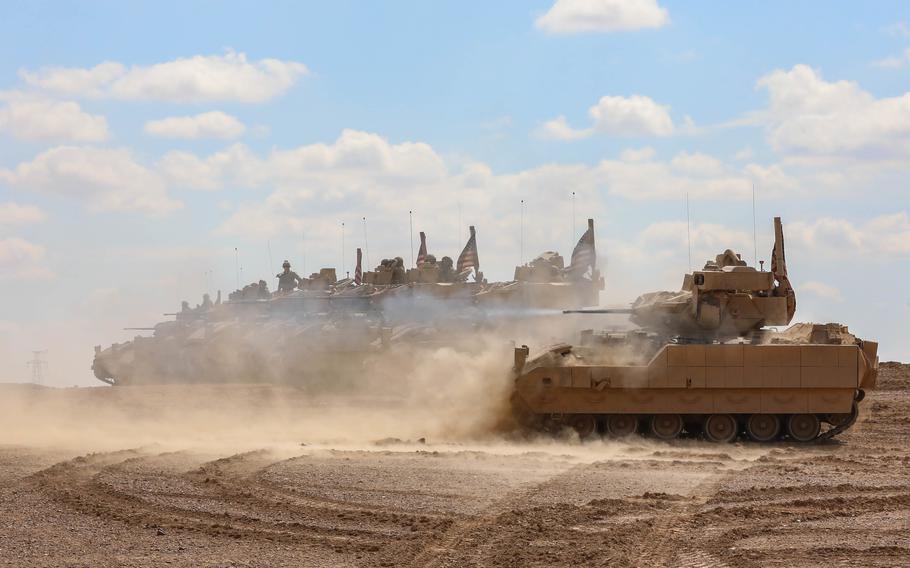 U.S. soldiers assigned to 2nd Platoon, Alpha Company, 1/163rd Combined Arms Battalion, fire M242 Bushmaster chain guns from Bradley M2A3 Fighting Vehicles during a live-fire exercise in Syria on March 25, 2022. 