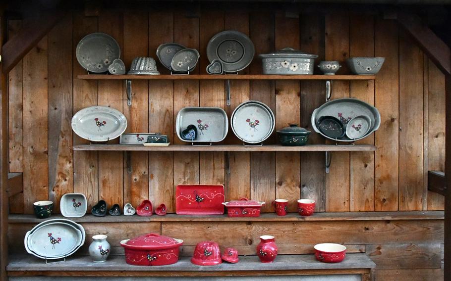 Traditional Alsatian pottery, including gugelhupf cake molds, terrines and serving dishes, is displayed at the entrance to Siegfried-Burger and Sons’ atelier and shop in Soufflenheim, France, Nov. 8, 2021. 