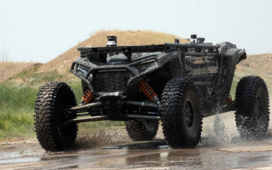 Soldiers roll out a fully autonomous tactical vehicle prototype.