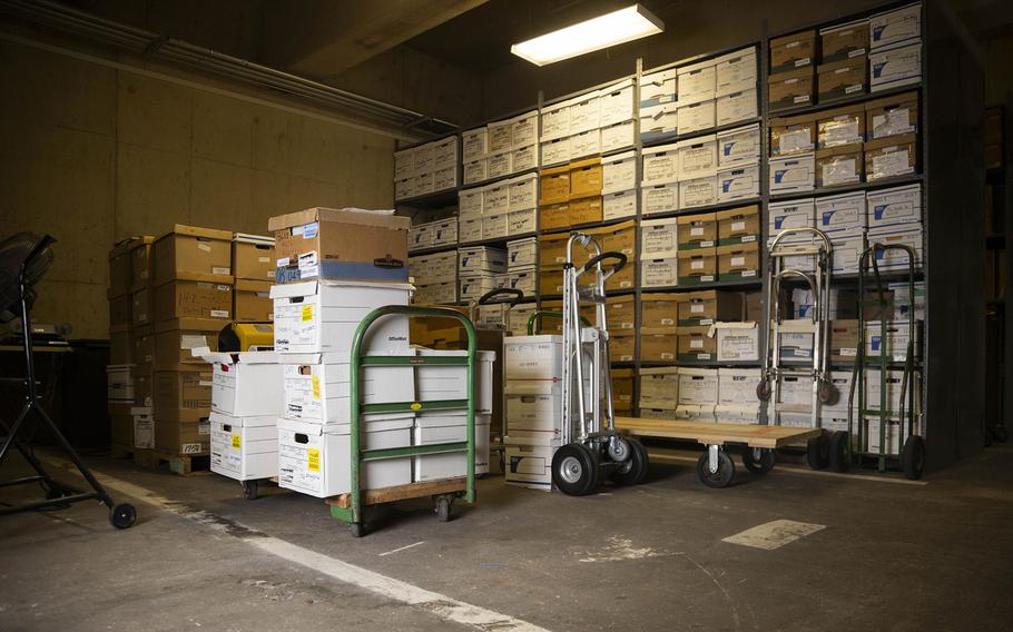 Boxes sit organized over the white lines of a portion of the underground parking lot at Dallas City Hall, which now serves as part of the records management operation for document storage. 