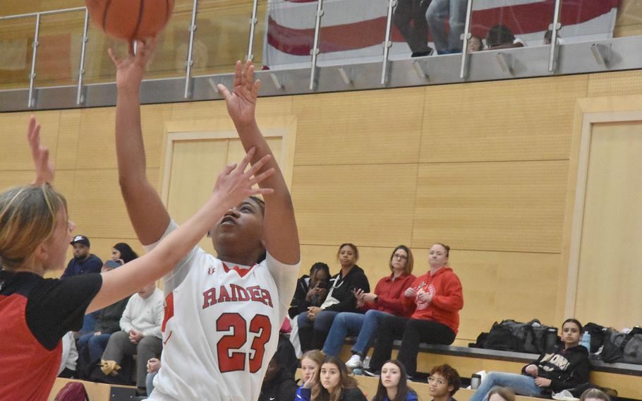 Shay King shoots a contested shot.