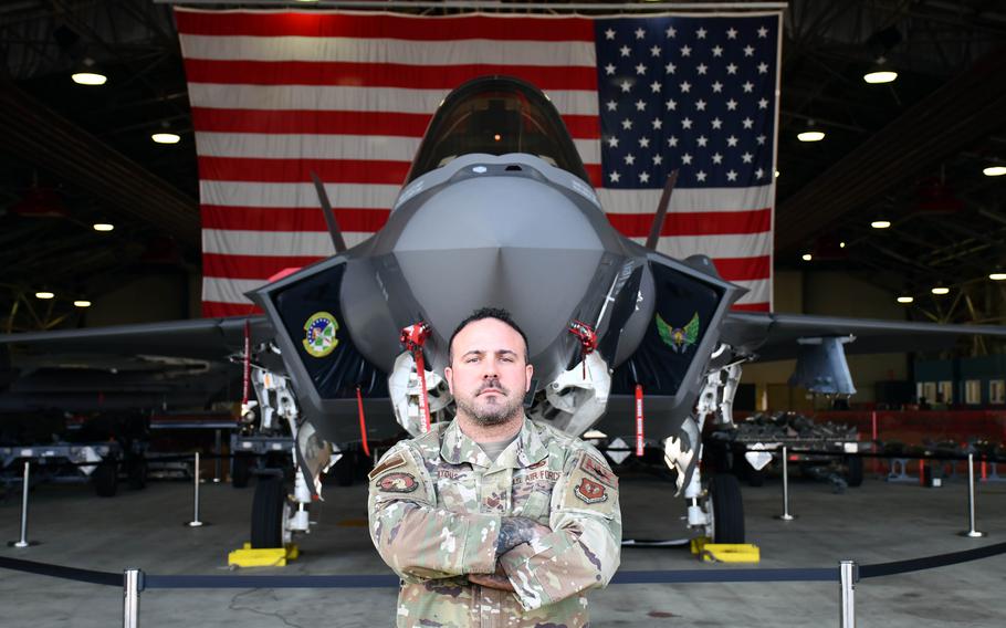 Tech. Sgt. Matthew Byous stands in front of an F-35A Lightning II at the 48th Equipment Maintenance Squadron at RAF Lakenheath, England, March 24, 2022. Byous, a third-generation airman, has been part of a working group seeking ways to help commanders and subordinates better communicate.  