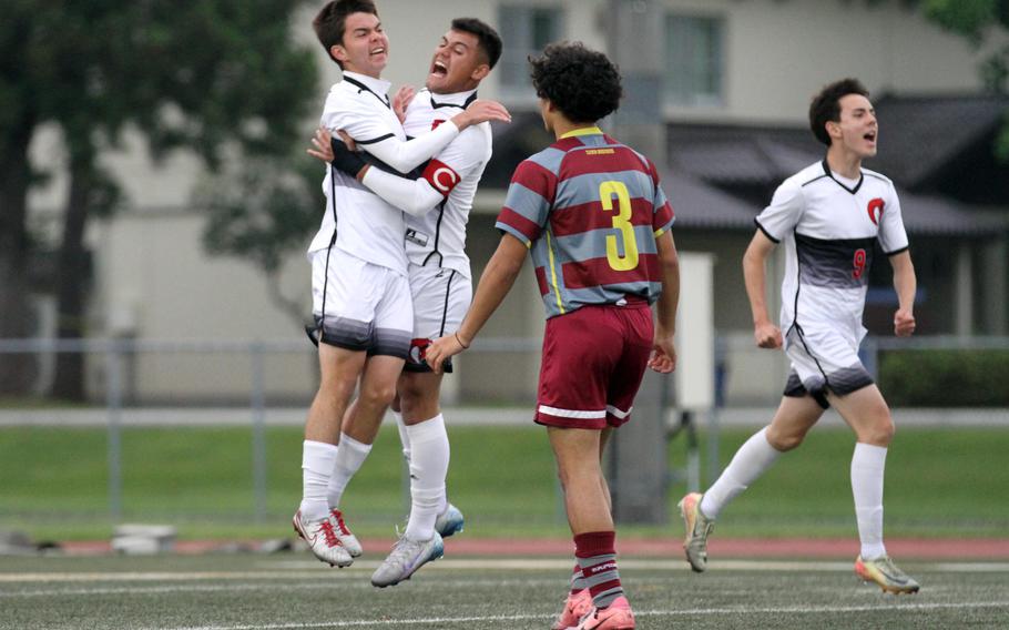King's Ben Duncanson and Damian Perez celebrate a goal against Perry.