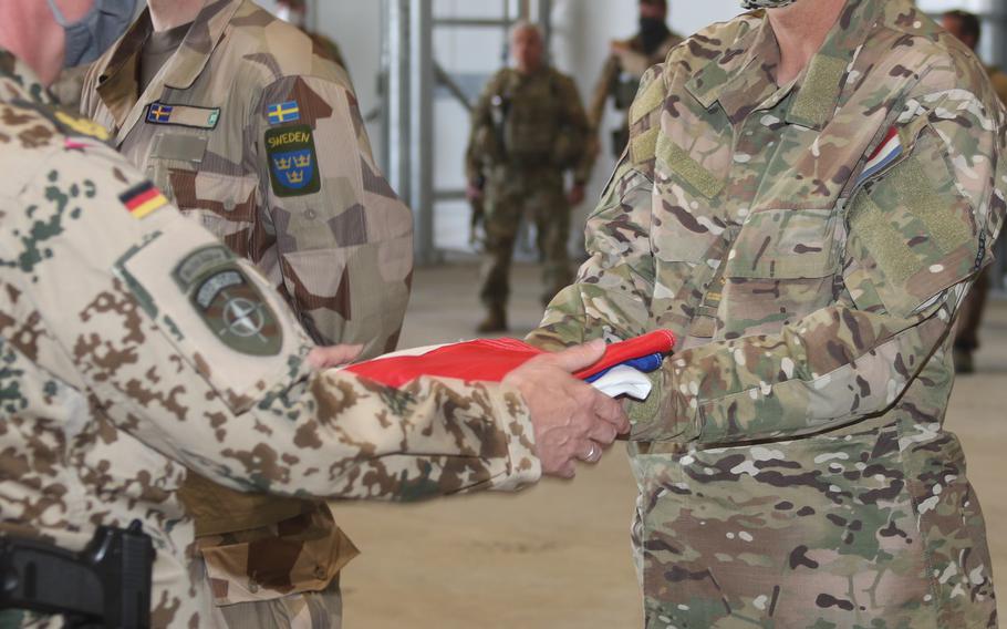 The flag of the Netherlands is lowered at a ceremony May 16, 2021 in Camp Marmal in northern Afghanistan. The ceremony symbolized the end of the mission to train, advise and assist Afghan forces.

Royal Netherlands Army