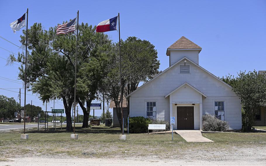 Flags fly outside the former First Baptist Church on June 7, 2022, in Sutherland Springs. 