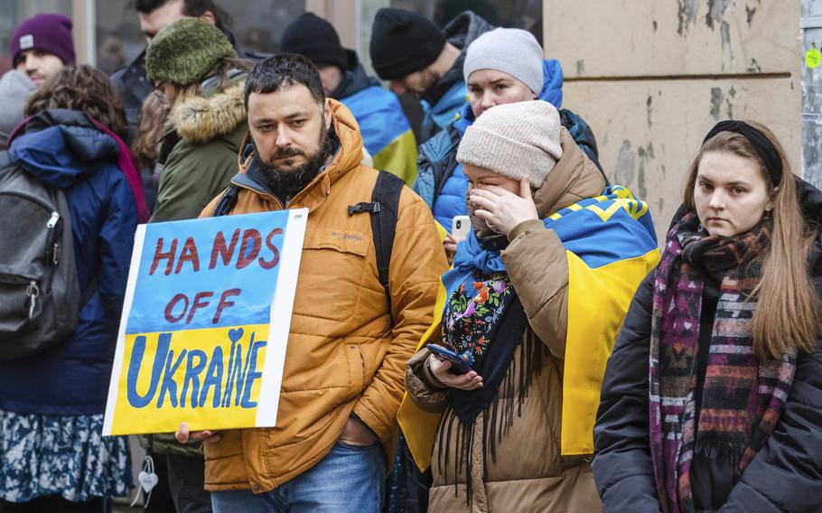 People including Ukrainians, take part in a demonstration in support of Ukraine, outside the Russian Embassy in Tallinn, Estonia, Thursday, Feb. 24, 2022. Russia launched a wide-ranging attack on Ukraine on Thursday, hitting cities and bases with airstrikes or shelling, as civilians piled into trains and cars to flee. Ukraine’s government said Russian tanks and troops rolled across the border in a “full-scale war” that could rewrite the geopolitical order and whose fallout already reverberated around the world.