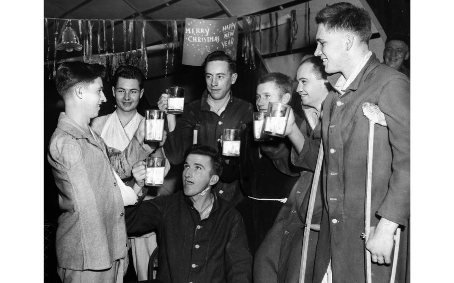Wounded service members at the 7th General Hospital in England raise a nonalcoholic toast to the impending arrival of what would be the last year of World War II, Dec. 31, 1944. When the photo ran in the Stars and Stripes, London edition issue of Jan. 2, 1945, the original caption read: “This is the sober toast to the New Year by men who know what life is like on the Western Front — GIs recuperating from wounds in the general hospital in England. The beverage in those massive mugs is milk. Yes, we said milk.”
