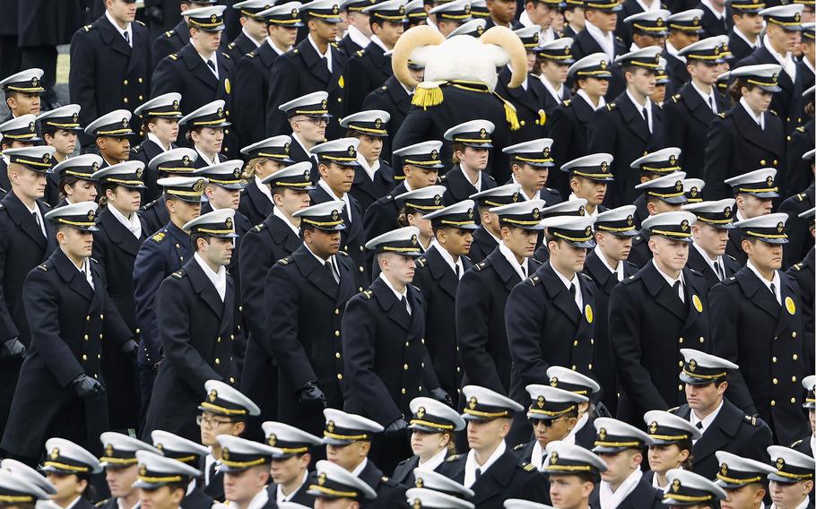 Navy Midshipmen march off the field before an NCAA football game between the Navy Midshipmen and the Army Black Knights at Gillette Stadium Saturday, Dec. 9, 2023, in Foxborough, Mass.