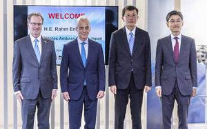 U.S. Ambassador to Japan Rahm Emanuel, center left, poses with officials of Mitsubishi Heavy Industries and Lockheed during his visit to a MHI’s F-35 fighter jet final assembly and inspection plant in Toyoyama on April 16, 2024.