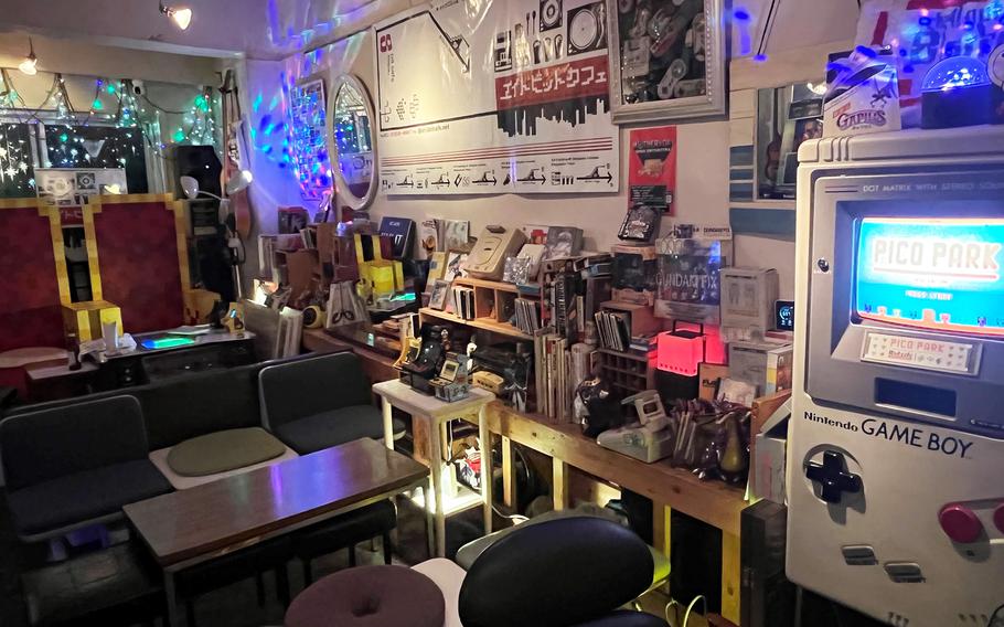 Visitors to 8 Bit Café in central Tokyo will find retro 1980s-themed game consoles and figurines. For example, Mario, Luigi and Yoshi are on top of a mirror in the bar.