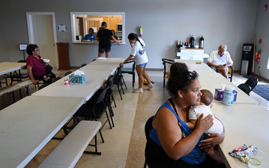 Jasmine Witt holds her 6-month-old daughter, Ivy Olena Witt, at Citizen Church in Maui on Tuesday, Aug. 15, 2023.