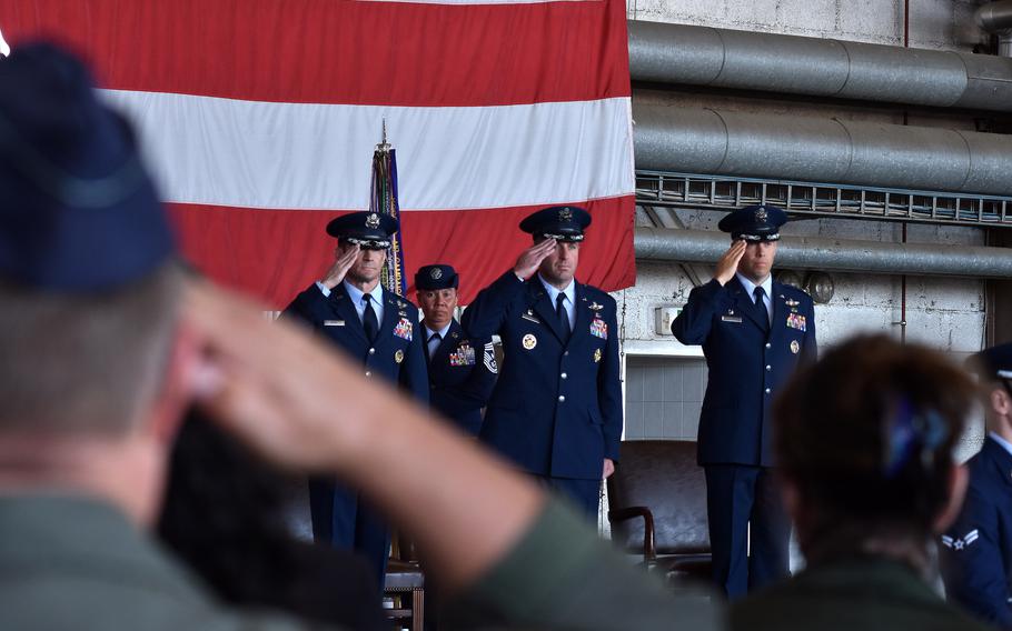 Men saluting.