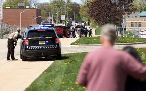 Law enforcement personnel respond to a report of a person armed with a rifle at Mount Horeb Middle School in Mount Horeb, Wis., Wednesday, May 1, 2024. The school district said a person it described as an active shooter was outside a middle school in Mount Horeb on Wednesday but the threat was “neutralized” and no one inside the building was injured.