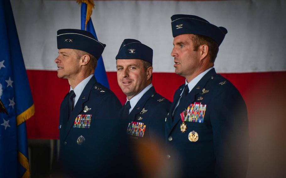 Col. Kevin Crofton, center, smiles to his family after taking command of the 52nd Fighter Wing at Spangdahlem Air Base in Germany on June 2, 2023.