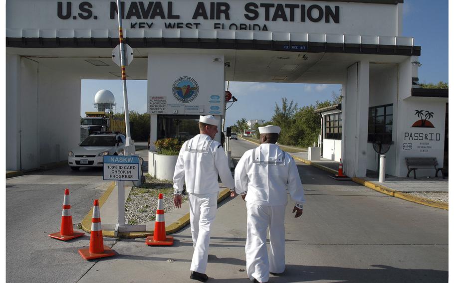 Two sailors walk to the main gate at Naval Air Station Key West in May 2008.