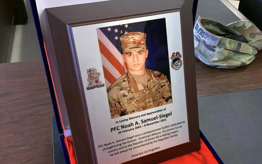A photo of a plaque that honors the memory of Pfc. Noah Samuel-Siegel.