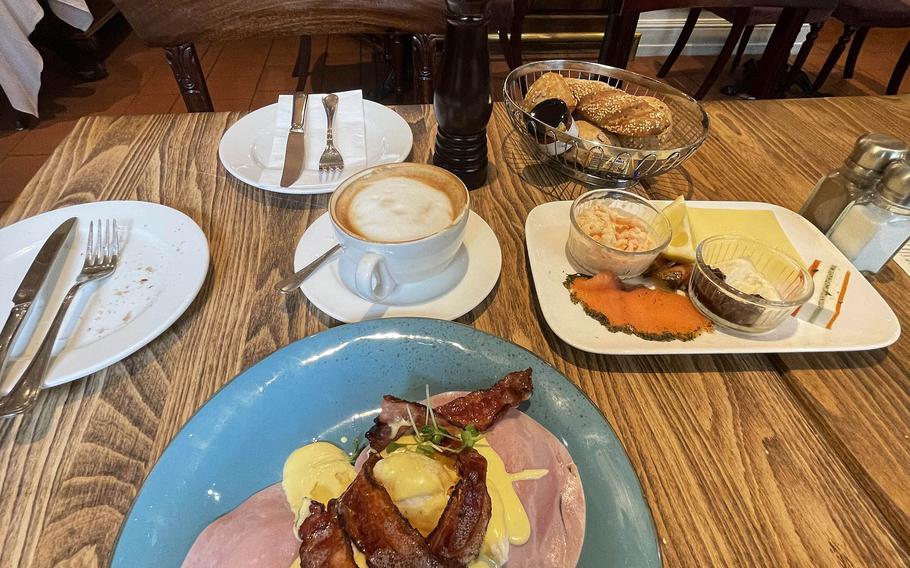 The eggs benedict, left, and the Belgravia, right. The Belgravia comes with smoked salmon, horseradish, crab salad, a slice of pate and different spreads for the breakfast rolls at The Victorian House, July 2, 2021 in Munich, Germany.