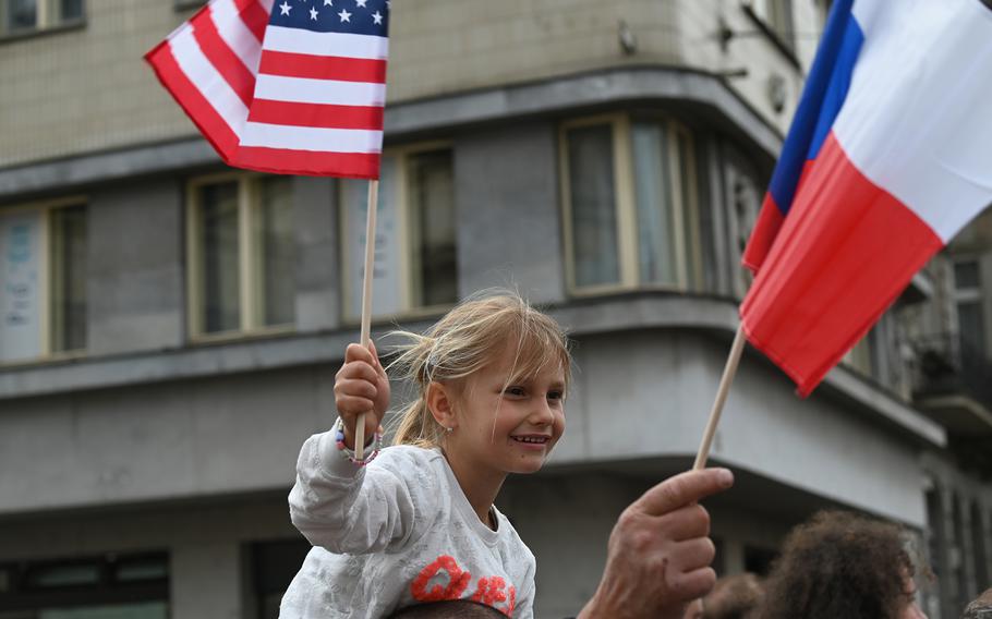 A young Czech girl waves an American flag during Liberation Festival Pilsen's parade of military vehicles on Sunday, May 5, 2024.