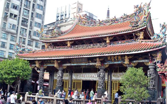 Lungshan Temple was established in Taiwan in 1738 during the Qing dynasty by settlers from mainland China and named after an older, 1,400-year-old temple in Fukien province.