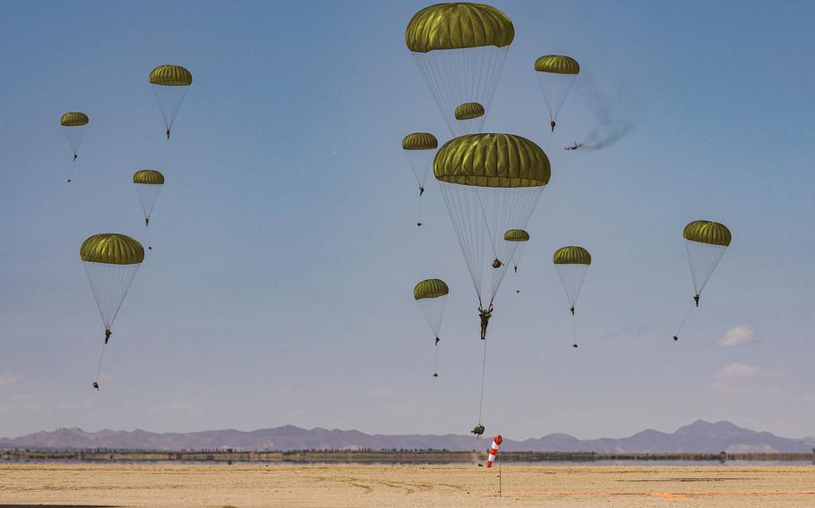 Utah National Guard and Moroccan armed forces land in a drop zone near Ben Guerir, Morocco, during exercise African Lion on May 20, 2024.