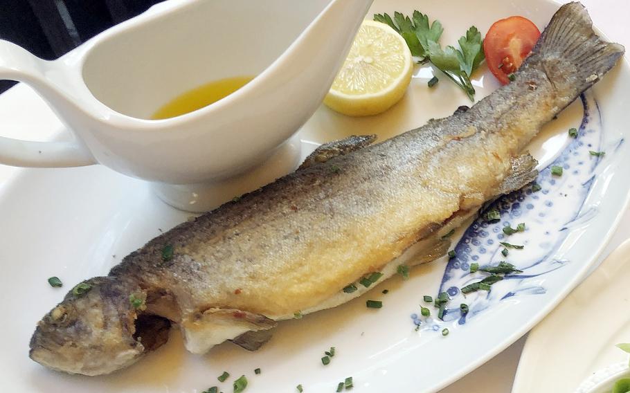 Trout classically fried in butter, in what is called “Muellerin” style, and served with boiled potatoes, chopped chives and a green salad at Forsthaus Rheinblick in Wiesbaden, Germany. The fresh fish was from the waters of the nearby Taunus Mountains.