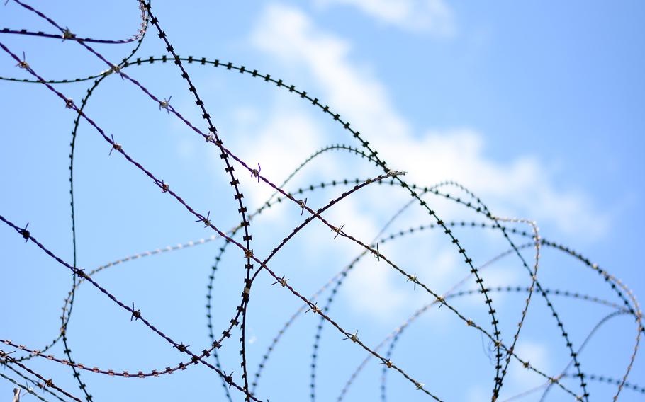 Concertina and barbed wire top a fence near the Demilitarized Zone between North and South Korea.