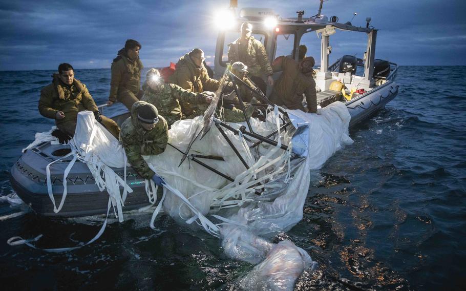 Sailors assigned to Explosive Ordnance Disposal Group 2 recover portions of a Chinese surveillance balloon off the coast of Myrtle Beach, S.C., on Feb. 5, 2023. A U.S. fighter jet shot down the balloon over U.S. territorial waters Feb. 4, 2023. Active-duty troops and Reserve, National Guard, and civilian personnel along with partners from the Coast Guard, Federal Aviation Administration and FBI took part in recovery efforts.