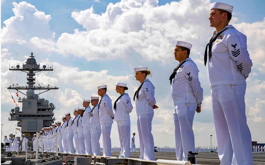 Sailors man the rails of the USS Gerald R. Ford as they depart Naval Station Norfolk, Va., in June 2021.