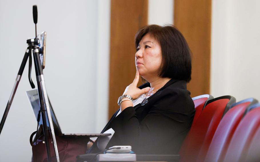 Sinmin Pak, founder of Unforgotten Butterflies, listens to a panel discussion on comfort women on April 22, 2023, at Dallas Hall in Southern Methodist University.