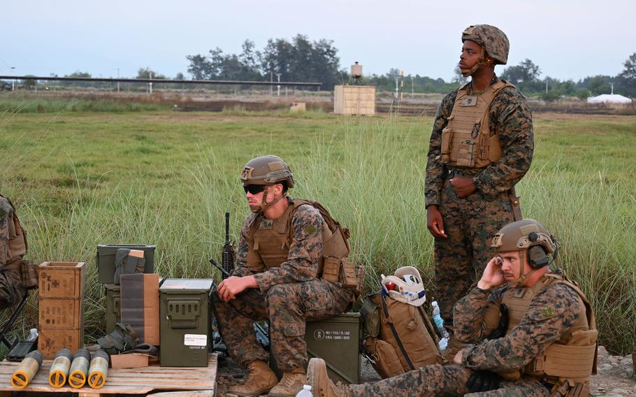 Members of the 3rd Marine Littoral Regiment supervise ammunition.