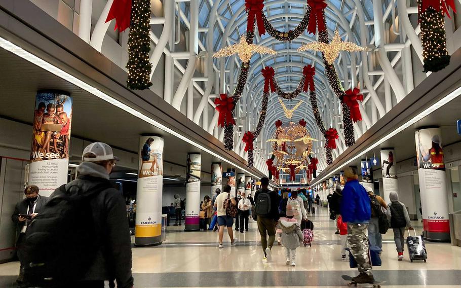 Thanksgiving travelers walk through Terminal 3 on Nov. 25, 2020, at O'Hare International Airport. Travelers who book trips during holiday times this year may notice higher airline prices and tighter flight schedules. 