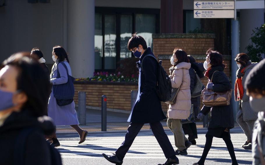 Tokyo reported 9,699 new coronavirus cases, a one-day record, Friday, Jan. 21, 2022. 