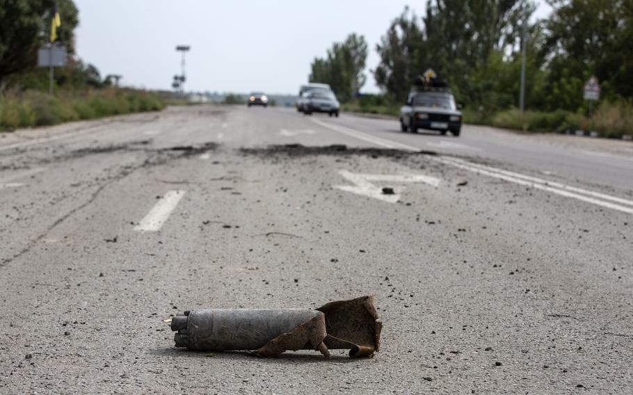 The two-lane road outside the village of Kamiyanske, Ukraine, on August 27, 2022. Convoys of cars travel in both directions in and out of Ukrainian and Russian held territory.