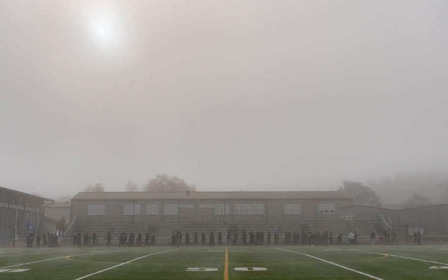 Members of the Kaiserslautern military community faced near-freezing temperatures to hold a Veterans Day march in foggy conditions at Kaiserslautern High School on Thursday, Nov. 11, 2021.