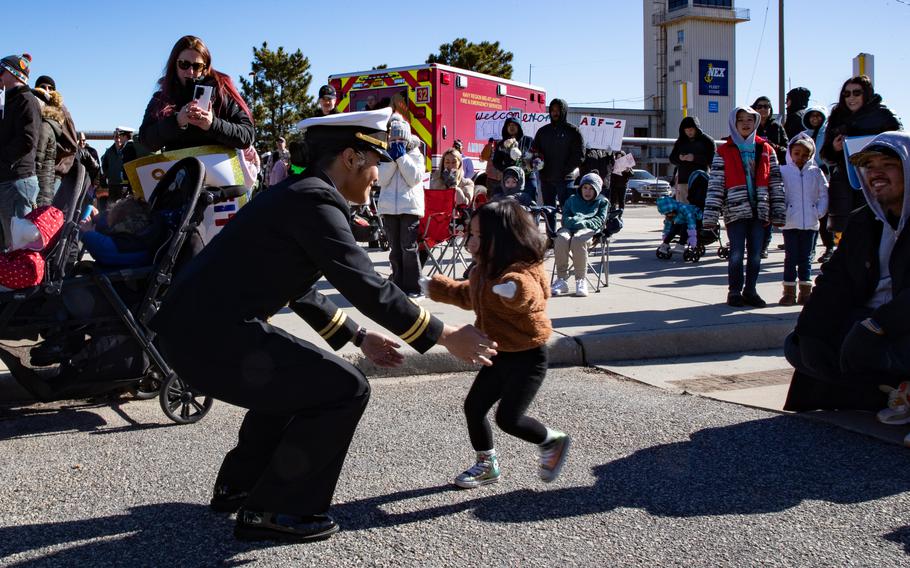 Lt. Sarah Alferos, assigned to the USS Gerald R. Ford, receives a welcome home from her family upon returning from an eight-month maiden deployment, Wednesday, Jan. 17, 2024. The Gerald R. Ford Carrier Strike Group (GRFCSG) completed a scheduled deployment in U.S. Naval Forces Europe-Africa/ U.S. Sixth Fleet area of operations.